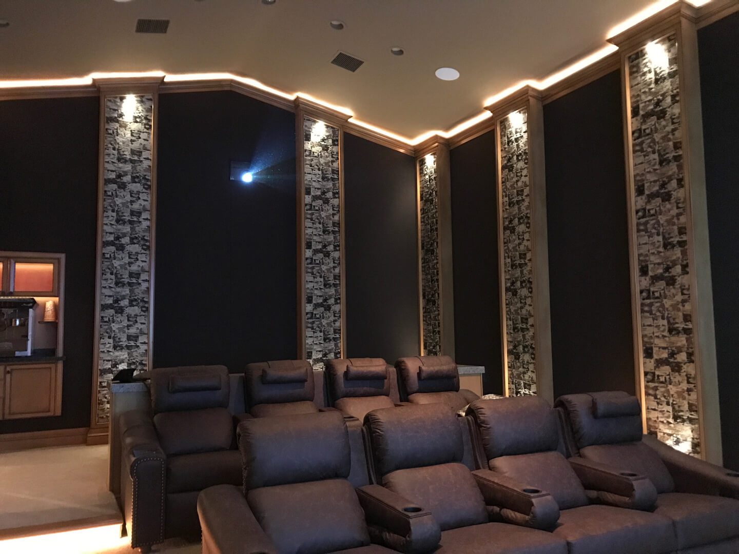 A room with several seats and lights in it