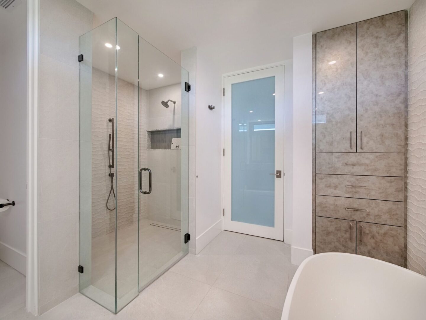 A bathroom with a shower and tub in it