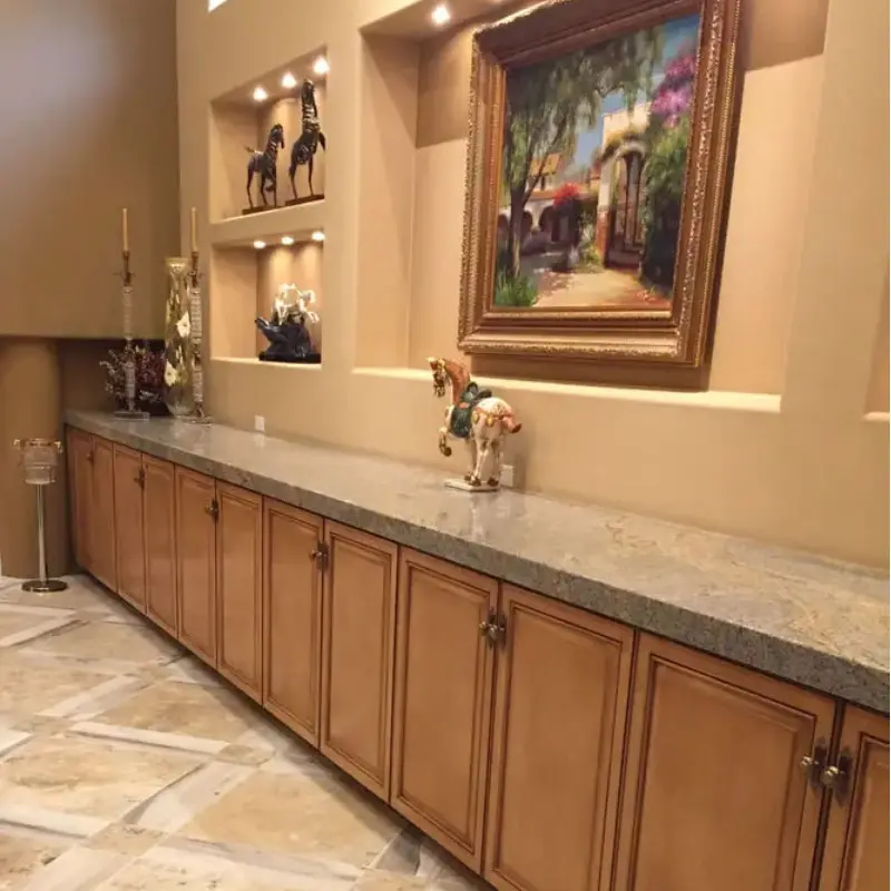 A large kitchen with marble counter tops and tile floors.